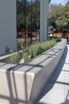 Raised flow-through planters edge much of Walnut Creek Library 