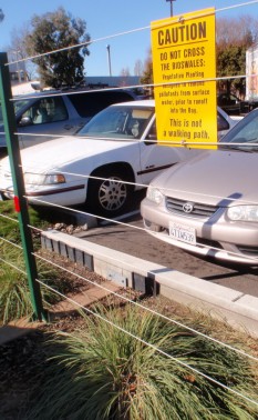 Warning sign and fence block swale, McDonald's, Berkeley