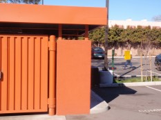 A covered trash enclosure keeps rain from washing pollutants onto concrete.